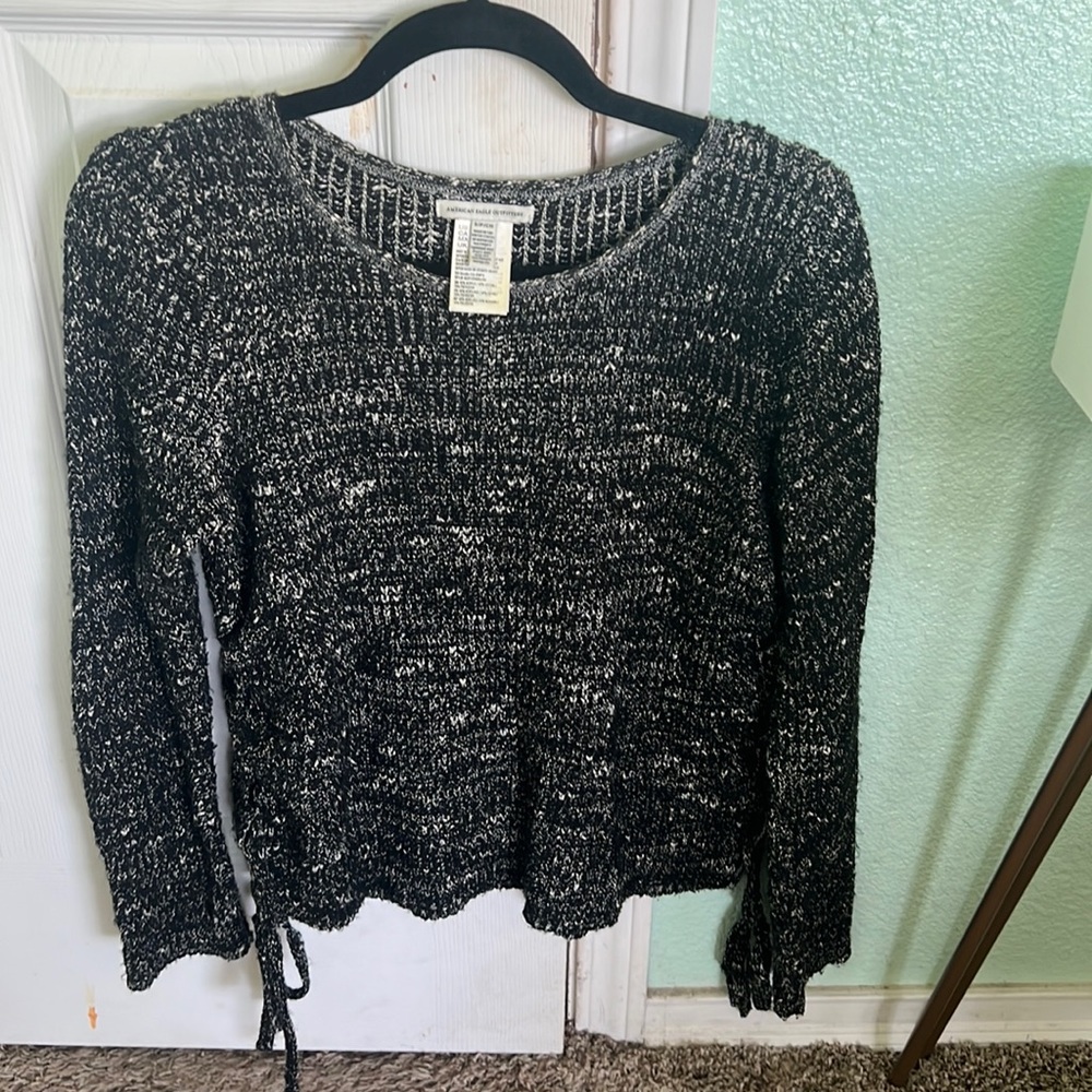 Selling black with white stitching sweater from American Eagle. Size is small